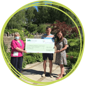 Phoebe's parents present CHSW with a cheque Dan-andLotty-present-cheque-to-CHSW